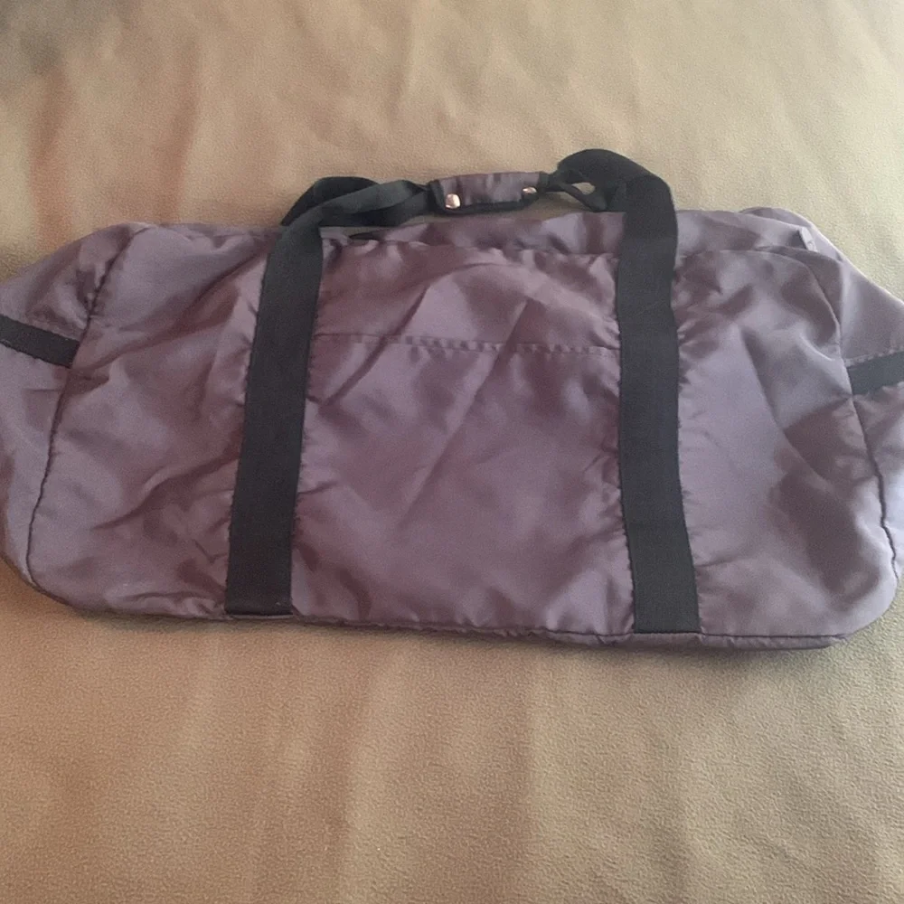 Dark gray and black nylon duffel bag. Approximately 27” x 15” x 11 1/2”